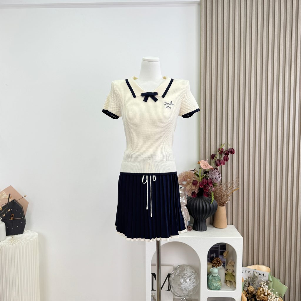 Women's Knit Sweater and Pleated Skirt Set - Apricot Top with Navy Skirt